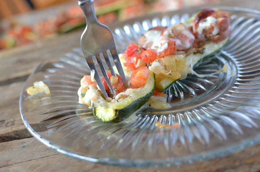 Looking for an easy and quick dinner that your family will love? Make these Healthy Spicy Bruschetta Stuffed Zucchini Boats!