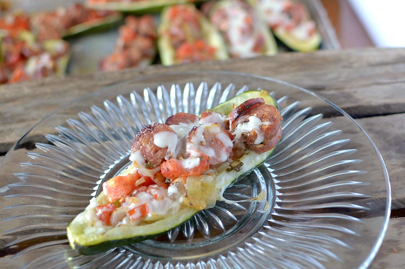 Looking for an easy and quick dinner that your family will love? Make these Healthy Spicy Bruschetta Stuffed Zucchini Boats!