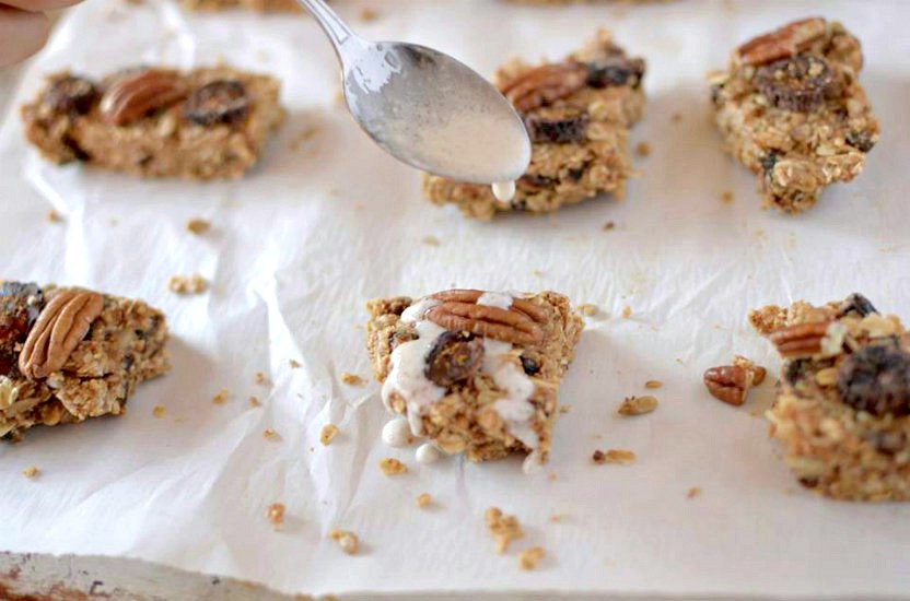 In need of a healthy snack that will satisfy you hunger as well as your sweet tooth? Make these No-Bake Pecan Fig Granola Bars with a Coconut Glaze that take no more than 10 minutes to make! Also Gluten-Free and Vegan!