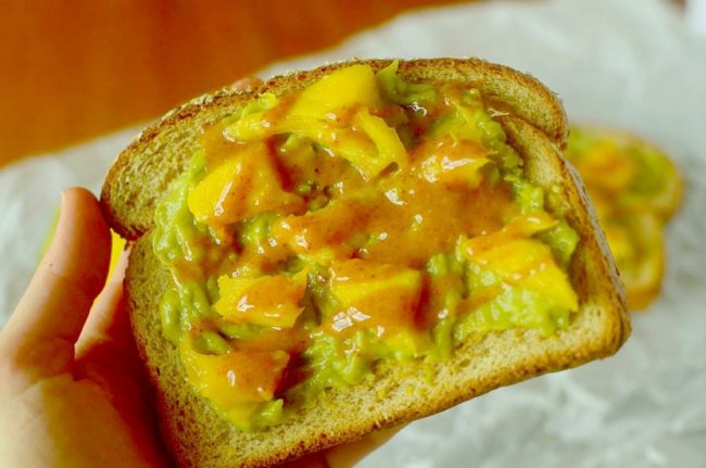 This Sriracha Mango Avocado Toast is a healthy and delicious breakfast or snack that is put together in less than 5 minutes and has a delicious almond butter-srirahcha drizzle! Also can be paleo, vegan and gluten-free!