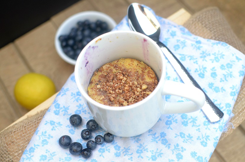 This Healthy Lemon Blueberry Crumb Cake In a Mug is a fast, easy and delicious breakfast, snack or dessert! It's the perfect summer treat made with real food ingredients such as almond flour, coconut sugar and fresh blueberries. Also paleo, gluten-free and has a vegan option!