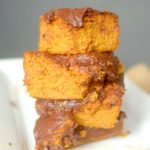 Satisfy your pumpkin cravings with this Paleo Pumpkin Snack Cake with Dark Chocolate Frosting. You won't believe that it's flour-less and made with only 7 ingredients! Also with a vegan option!