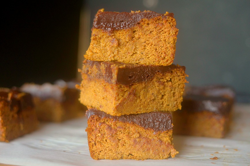 Satisfy your pumpkin cravings with this Paleo Pumpkin Snack Cake with Dark Chocolate Frosting.  You won't believe that it's flour-less and made with only 7 ingredients!  Also with a vegan option!
