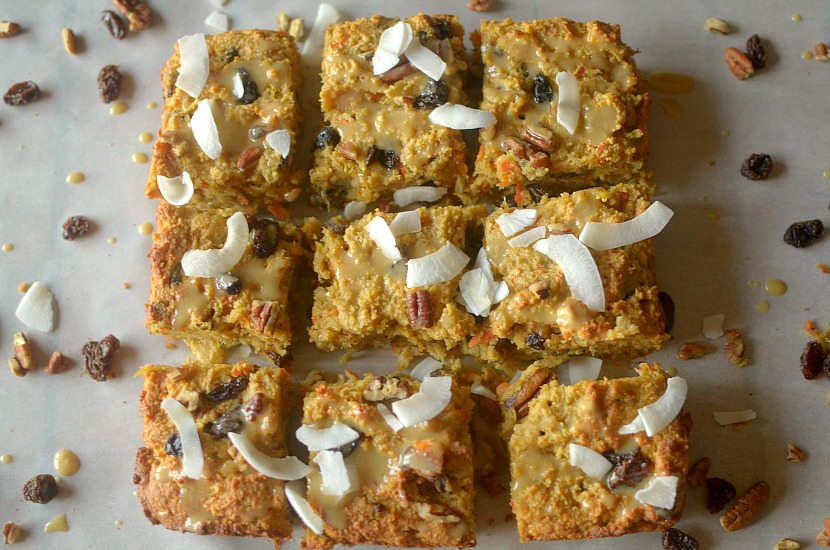 Healthy Carrot Cake Tahini Bread is a fluffy and delicious breakfast,snack or dessert filled with carrots, raisins, nuts and topped with a tahini-maple glaze! It's also paleo, gluten-free and vegan!