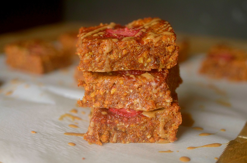 Need a healthy grab n’ go breakfast? Make these delicious Almond Butter & Jelly Coconut Breakfast Bars for the perfect way to satisfy your early morning appetite! Paleo and Vegan friendly!